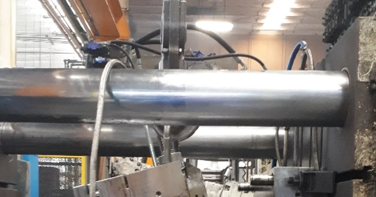 One half of a die casting die mounted in the machine, with the tool steel visible